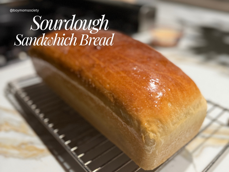 “Soft sourdough sandwich bread sliced on a cutting board”